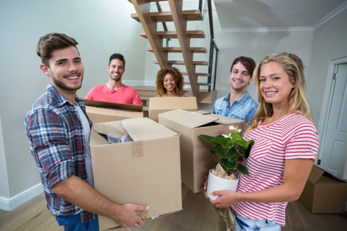 Packing and loading items into a moving van in St Giles