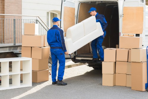 Careful furniture carrying with safety precautions in place
