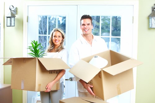 Packed moving boxes and furniture for a St Giles home removal