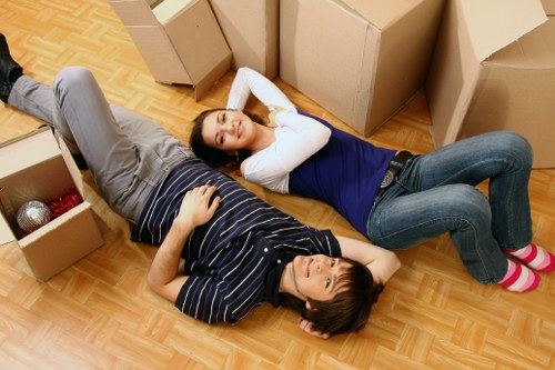 Professional movers handling furniture and boxes for a St Giles house move